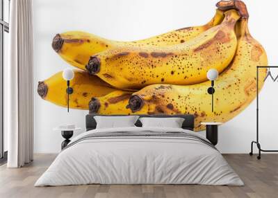 A cluster of ripe bananas with yellow skin and brown spots, perfect for healthy snacks or smoothies. Wall mural