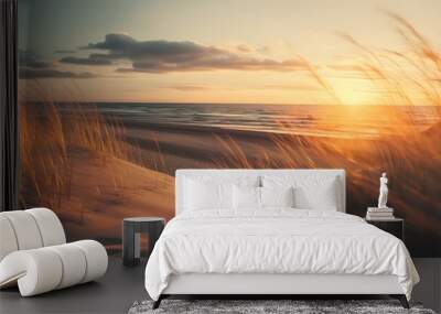 Admire the beauty of a grass dunes beach at sunset with sunlights shimmering Wall mural