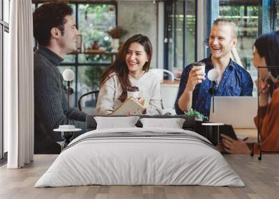 Group of young business people discussing and meeting at coffee cafe Wall mural