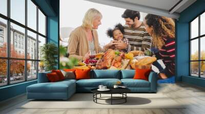 Happy Thanksgiving dinner party with family and food with turkey on table Wall mural