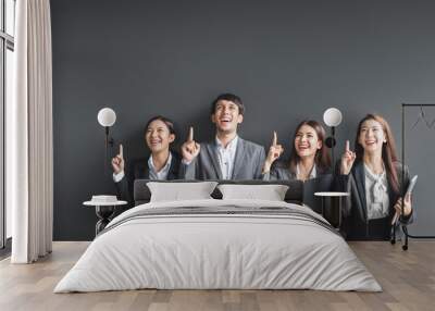 Portrait group of Asian business people in formal suit over black background Wall mural