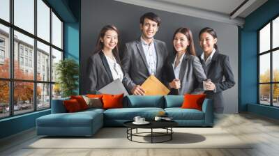 Portrait group of Asian business people in formal suit over black background Wall mural