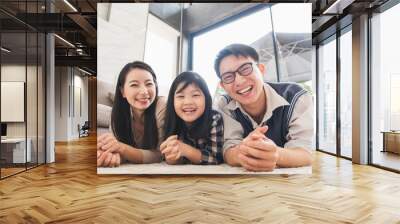 Portrait happy asian family at living room Wall mural