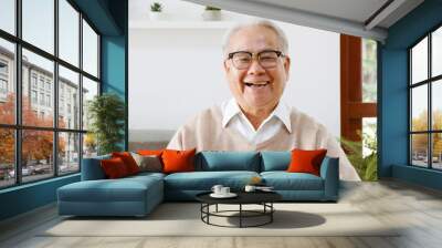 POV Asian old senior man video call virtual meeting with family Wall mural