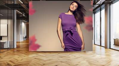 autumn portrait of beautiful woman wearing purple dress Wall mural