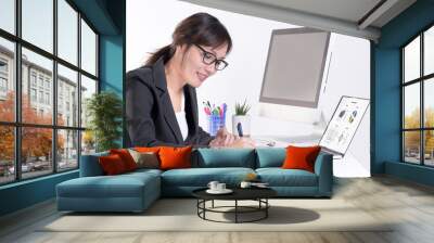 Happy businesswoman working at desk in busy creative office. Busy doing devoted to her career many things at the same time. Isolated On white. Wall mural