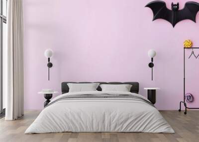 Pastel Halloween decors with bats, pumpkins, and candy, 3D illustration Wall mural