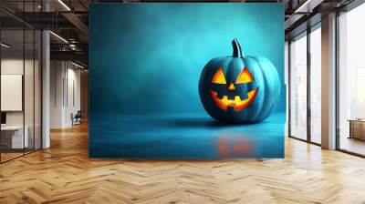 Bright blue Halloween party background with an orange jackolantern pumpkin, designed with ample copy space for festive text Wall mural