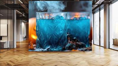 Two spooky cocktails with blue liquid and ice cubes, shrouded in mist, with carved pumpkin lanterns and scattered autumn leaves, ideal for Halloween party promotions or cocktail recipes, Wall mural