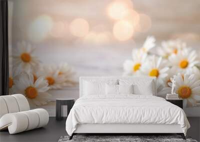 Beautiful daisy flowers on a wooden surface with soft bokeh lights. Wall mural