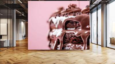 Close-up of a decadent chocolate cake with rich frosting dripping down the sides against a pink background. Perfect for dessert lovers. Wall mural