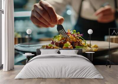 A close-up of a food critic's hands holding a fork, poised above an artistically plated meal, with a blurred background of a restaurant Wall mural