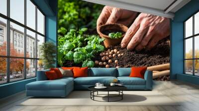 A close-up of a horticulturist's hands planting seeds in rich soil, with tools and pots scattered around Wall mural