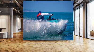 A man driving a jet ski Wall mural