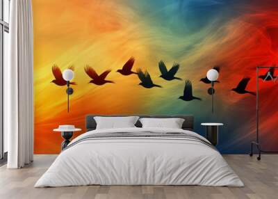 Dynamic abstract birds with elongated wings set against a gradient sunset sky Wall mural