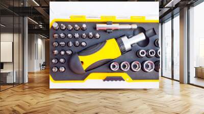 equiped Tool Kit. Instrument. Miter heads and keys. compact set in a yellow plastic box with a transparent cover.tools kit detail close up Wall mural