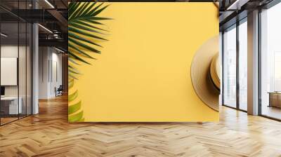 flat lay with traveler accessories tropical palm leaf, retro camera, sun hat, starfish on yellow background Wall mural