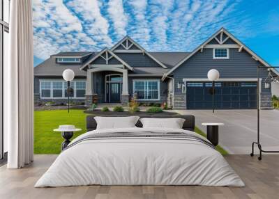 Home with gray siding and a garage with black doors Wall mural