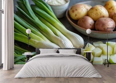 ingredients for homemade potato leek soup with fresh produce Wall mural