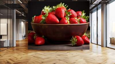 A bowl filled with ripe and juicy strawberries. Wall mural