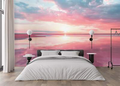 A pink sunset reflecting on the calm surface of a pink lake. Wall mural