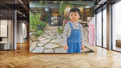 Portrait of a smiling boy, embodying joy and childhood happiness indoors Wall mural