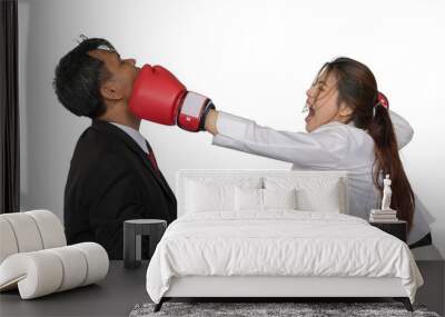 Asian business woman is wearing a boxing glove punch business man With a white background. Wall mural