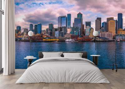 Seattle city skyline at sunset, dramatic cloudscape, and the vista of the metropolitan downtown financial district over Elliot Bay in Washington State Wall mural