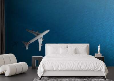 Aerial top view of Airplane flies over a sea, view from above Wall mural