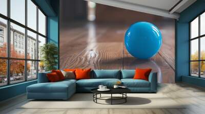 Blue sports ball resting on wooden floor surface, ideal for athletic training, playtime, and active sports-themed concepts in indoor recreation settings


 Wall mural