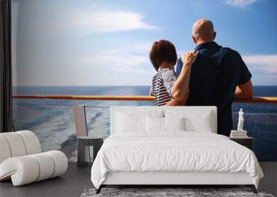 caucasian man and brunette woman in sunglasses traveling together on cruise ship,standing on balcony and enjoying with beautiful view of Caribbean sea Wall mural