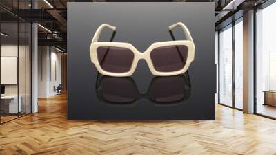 Fashionable sunglasses close-up on a dark gray glossy background.  Wall mural