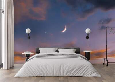 New moon in the sky near Venus at sunset. Venus next to the Moon. Beautiful celestial landscape. Wall mural