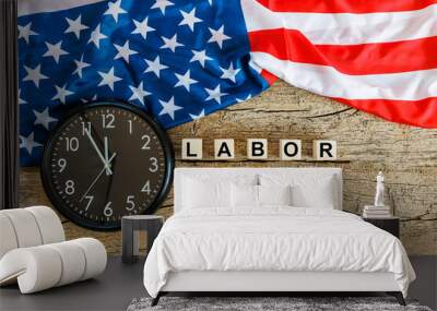 US American flag with wooden cubes with word Labor day and clock on old wooden background. Labor day celebration.  Wall mural