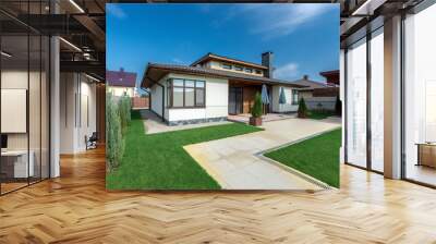 beautiful modern house in cement, view from the garden Wall mural