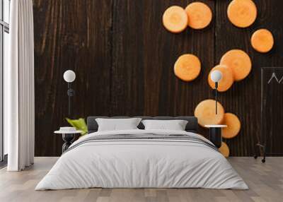 sliced carrot on  slate and wooden counter top background Wall mural