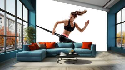 Woman exercising fitness resistance bands in studio silhouette isolated on white background Wall mural