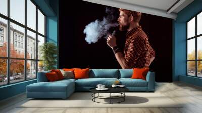 young man smoking electronic cigarette Wall mural