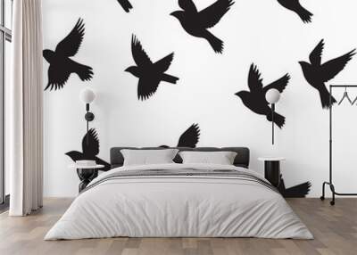 Set of silhouettes of birds, Silhouette vector of sparrows in flight icon Wall mural