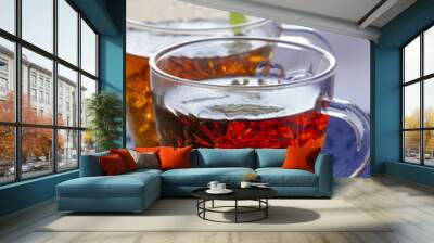 two glasses of tea on the blue table Wall mural