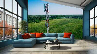 Aerial drone view of 5G telecommunication tower. GSM and radio telecommunication tower. Cell phone tower. Base transceiver station. Wireless communication antenna transmitter. Wall mural