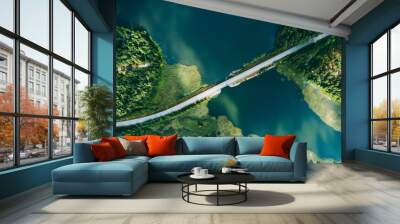 Aerial view of bridge asphalt road with cars and blue water lake and green woods in Finland. Wall mural