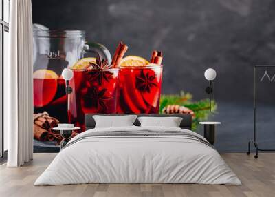 Christmas sangria or mulled wine with apples, oranges, pomegranate and cinnamon sticks. Wall mural