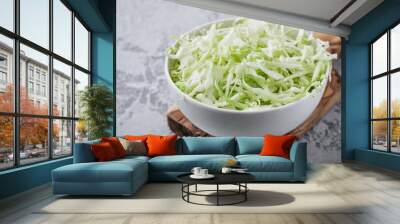 Fresh green cabbage cut. Sliced cabbage in bowl Wall mural