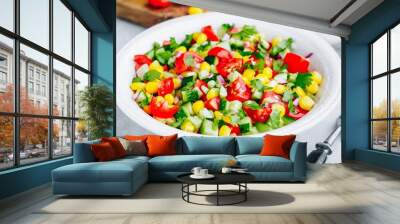 Fresh summer corn salad bowl with tomatoes, cucumbers, red onions and parsley. Wall mural