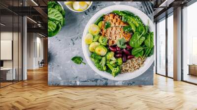 Healthy buddha bowl lunch with grilled chicken, quinoa, spinach, avocado, brussels sprouts, broccoli, red beans with sesame seeds Wall mural