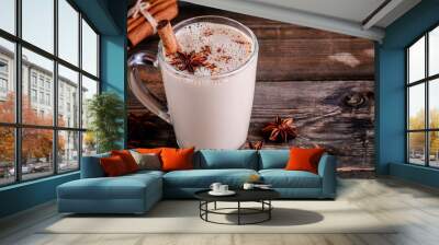 Homemade Chai Tea Latte with anise and cinnamon stick in glass mug Wall mural