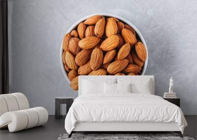 raw whole almond in bowl Wall mural