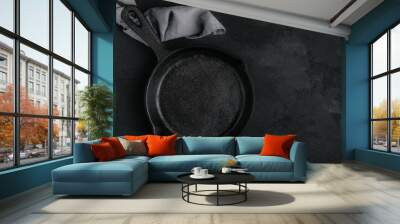 Roast Pan. Empty cast iron frying pan on dark stone background Wall mural