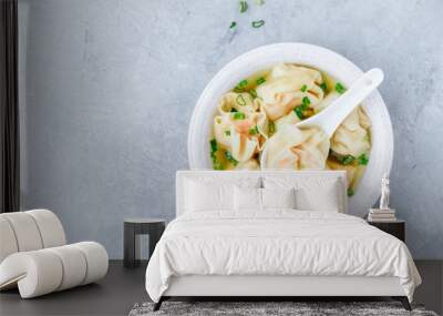 Wonton soup bowl. Shrimp or pork wonton soup with green onion Wall mural